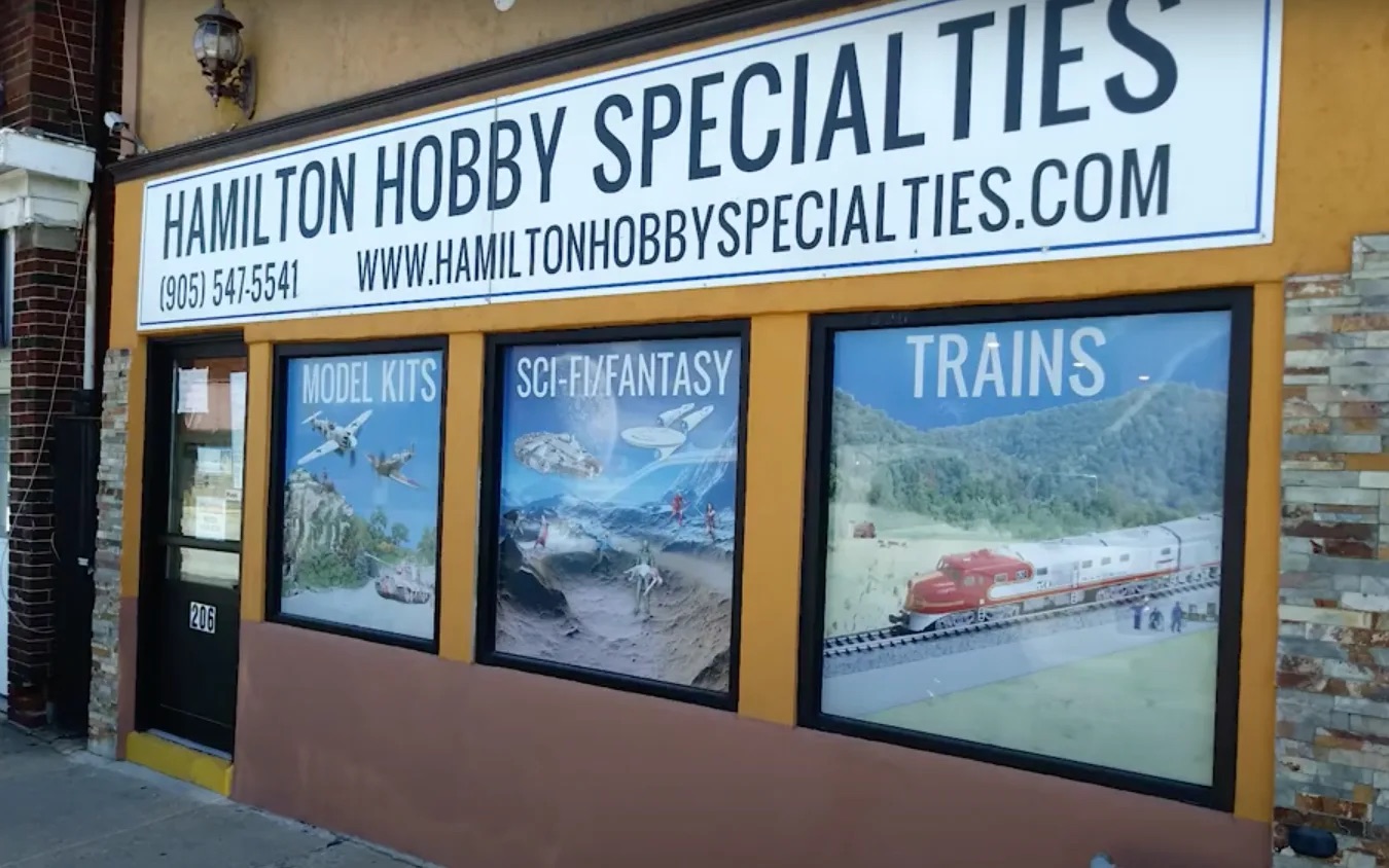 Hamilton Hobby Specialties storefront on Kenilworth Ave N with Model Kits, Sci-Fi/Fantasy, and Trains window displays